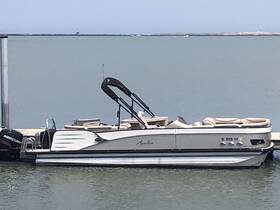 A sleek pontoon boat docked peacefully at the marina, showcasing its stylish design and spacious seating, perfect for leisurely outings on the water.