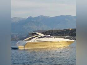 A stunning yacht glides through calm waters, showcasing its sleek design against a backdrop of majestic mountains — perfect for luxury cruising.