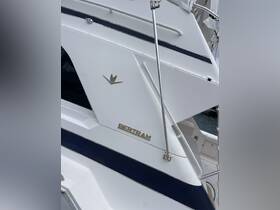 Close-up view of a Bertram boat showcasing its sleek design and branding, perfect for boating enthusiasts and potential charter clients.