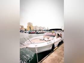 A group of friends relaxes aboard the 'Sea Breeze' boat docked at the marina, perfect for enjoying a day on the water.
