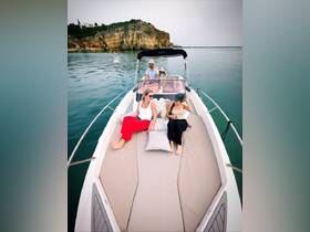 A joyful group enjoys a relaxing day on a boat, surrounded by stunning coastal scenery — perfect for family outings or leisurely cruises.