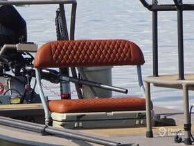 A close-up view of a stylish boat seat, showcasing the comfortable design ideal for relaxing on the water.