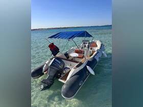 A sleek speedboat anchored in clear turquoise waters, showcasing its stylish design and inviting atmosphere for a day on the water.
