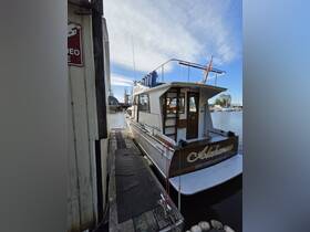 A well-maintained yacht named 'Ablahanna' docked at a marina, showcasing its elegant design and inviting atmosphere.