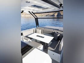 A stylish interior view of a yacht's dining area, featuring comfortable seating and a sleek table, perfect for enjoying meals while cruising on the water.