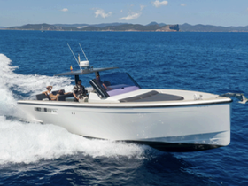 A sleek speedboat cuts through the waves with guests onboard, showcasing the thrill of a day on the water.