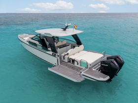 A stunning aerial view of a sleek boat cruising through crystal-clear turquoise waters, perfect for luxury outings or island adventures.