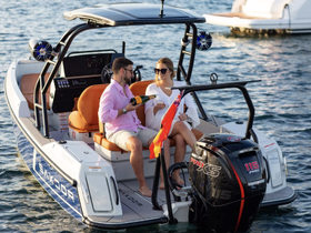 A couple enjoys a celebratory moment aboard a stylish boat, perfect for romantic outings or special occasions on the water.