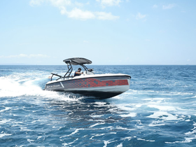 A sleek speedboat cuts through the waves, showcasing an exhilarating day on the water — perfect for adventure seekers and water sports enthusiasts.
