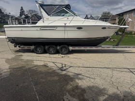 A side view of the 'Feelin Fish' boat securely docked on its trailer, showcasing its sleek design and readiness for the water.