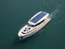 A stylish yacht cruising through clear waters with guests enjoying the sun on deck — perfect for luxury outings and memorable experiences on the water.