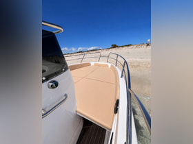 A close-up view of the comfortable seating area on a boat, showcasing a spacious and inviting space perfect for relaxation while enjoying the water.
