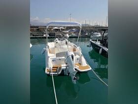 A sleek speedboat docked at the marina, showcasing its modern design and pristine condition — perfect for a day on the water.