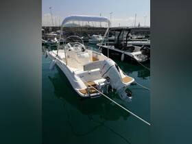 A sleek speedboat docked in a marina, showcasing its modern design and inviting atmosphere for a day on the water.