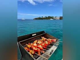 A vibrant display of grilled seafood and vegetables on skewers, perfect for a delicious barbecue experience on the water.
