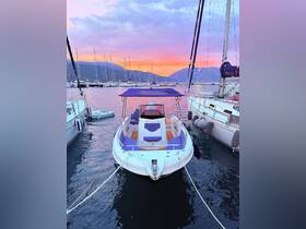 A stunning view of a yacht docked at sunset, surrounded by other boats, showcasing the tranquil beauty of the marina.