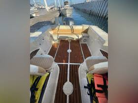 Interior view of a boat's seating area featuring stylish upholstery and ample space, perfect for relaxing while cruising on the water.