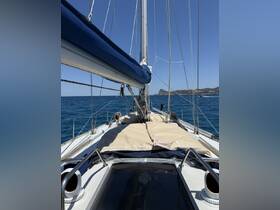 A view of the helm area on a sailboat, showcasing the seating and equipment, perfect for a relaxing day on the water.