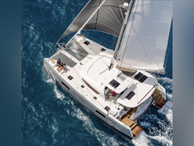 Aerial view of a group enjoying a catamaran sailing adventure, capturing the essence of fun and relaxation on the open water.