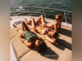 Three friends enjoy a relaxing day sunbathing on the deck of a yacht, perfect for unwinding and enjoying the sun on the water.
