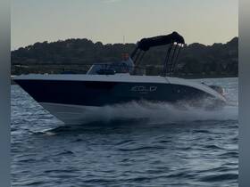 A sleek speedboat glides across the water with a driver at the helm, showcasing the thrill of boating adventures.