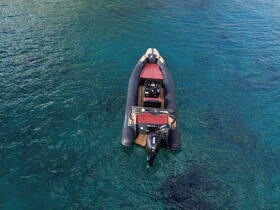Aerial view of a sleek speedboat gliding through crystal-clear waters, perfect for thrilling adventures on the open sea.