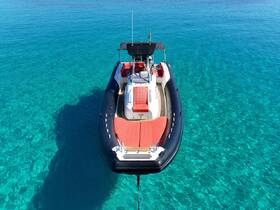 A stunning aerial view of a sleek speedboat anchored in crystal-clear waters, perfect for exploring coastal destinations or enjoying a day on the water.