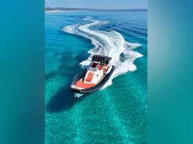 A stunning aerial view of a sleek speedboat cutting through crystal-clear waters, showcasing the beauty of a perfect day on the sea.