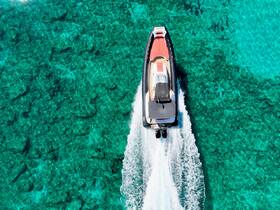 A stunning aerial view of a sleek speedboat gliding over crystal-clear turquoise waters, showcasing the vibrant underwater landscape — perfect for adventure seekers and boat enthusiasts.