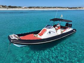 A sleek boat navigates through crystal-clear waters, showcasing a perfect day for exploration and adventure on the sea.