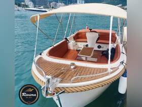 A cozy interior view of a boat featuring comfortable seating and a helm, perfect for relaxing on the water. Ideal for private charters and leisurely boat tours.