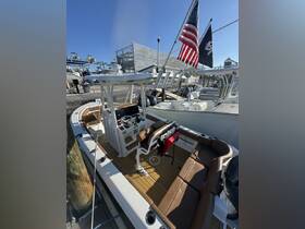 An inviting interior view of a well-equipped boat helm and seating area, showcasing the perfect setup for a day on the water.