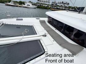A spacious seating area at the front of a boat, perfect for relaxing and enjoying the views while cruising.