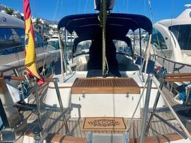 A cozy view of the interior helm area of a yacht, featuring a welcoming mat and well-maintained wooden surfaces, ideal for relaxing while enjoying the sea.