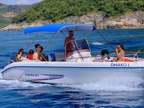 A lively group enjoys a day on the water aboard the DHako1, showcasing the fun and excitement of boating with friends.