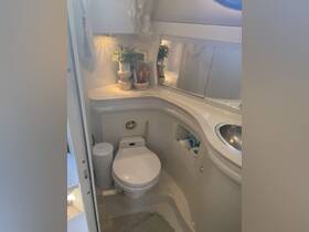 A well-appointed boat bathroom featuring modern amenities and elegant decor, perfect for comfort while at sea.