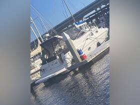 A sleek yacht named 'All's Well' docked at the marina, showcasing its elegant design and surroundings.
