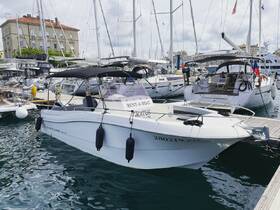 A sleek boat docked at the marina, showcasing its elegant design and ready for rental adventures on the water.