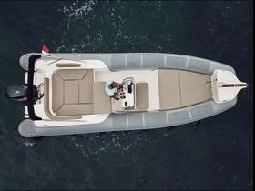 An aerial view of the interior of a sleek boat, showcasing the helm and comfortable seating area, perfect for a day on the water.