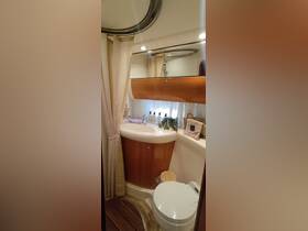 A well-appointed bathroom inside a boat, featuring modern fixtures and elegant design elements, perfect for comfort on the water.