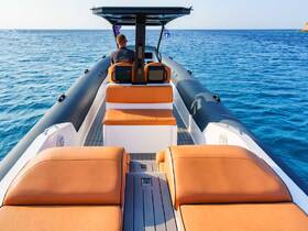 A view of the stylish interior of a boat featuring comfortable seating and a helm, perfect for enjoying a day on the water.