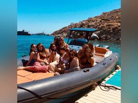 A lively group of friends enjoys a sunny day on a boat, perfect for celebrations and summer adventures in beautiful waters.