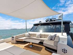 A stylish lounge area inside a luxury yacht, featuring comfortable seating and a modern design, perfect for relaxing while enjoying scenic views on the water.