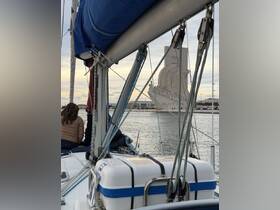 Guests enjoy a scenic sailing experience with a view of the iconic landmark in the background, perfect for sightseeing and exploring the waterfront.