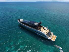 A stunning aerial view of a luxurious yacht cruising through crystal-clear waters, perfect for upscale charters and ocean adventures.