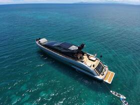 A stunning aerial view of a luxurious yacht cruising through crystal-clear waters, showcasing its sleek design and inviting deck space.