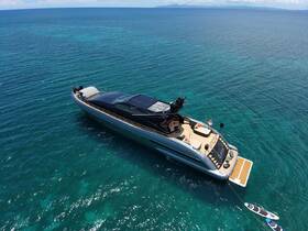 A stunning aerial view of a luxurious yacht cruising through crystal-clear waters, showcasing its sleek design and inviting deck space.