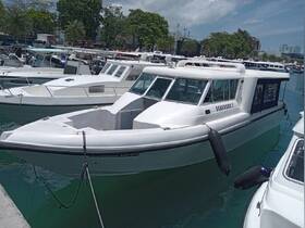 A sleek boat named 'Seaguard 2' docked at the marina, showcasing its modern design and readiness for adventure on the water.