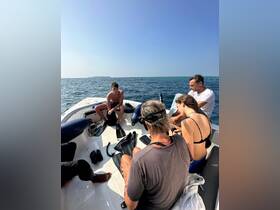 A group prepares for a snorkeling adventure aboard a boat, showcasing the excitement of water activities and camaraderie among friends.