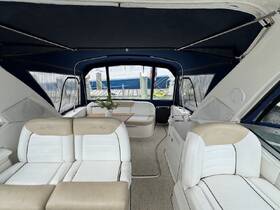 A spacious interior view of a Sea Ray boat, showcasing comfortable seating and a well-designed cabin area, perfect for relaxing during outings on the water.